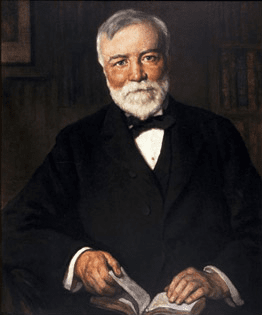 Painting of Andrew Carnegie reading a book. This depiction of Andrew Carnegie was sent out by the Carnegie Corporation to the libraries to commemorate the 100th anniversary of Carnegie’s birth. A very high percentage of Iowa’s Carnegie libraries still have the image hanging in their libraries.