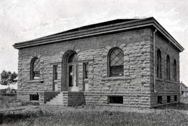 Black and white image depicting the front exterior of the Hawarden Public Library. 