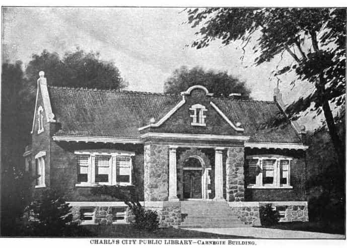 Black and white image showing the front exterior of the Charles City Public Library. 