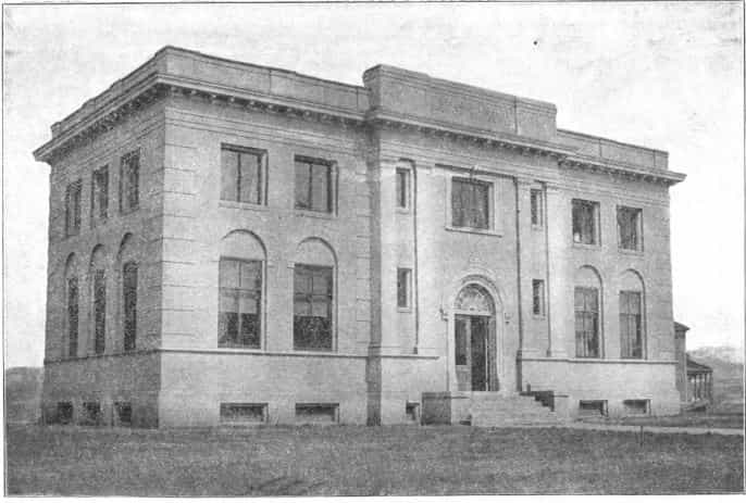Black and white image showing the exterior of the Newton Public Library. 