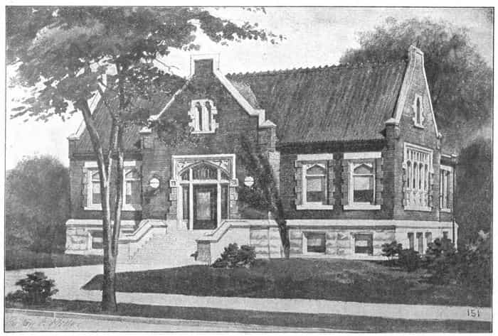 Black and white image showing the front exterior of the Spencer Public Library. 