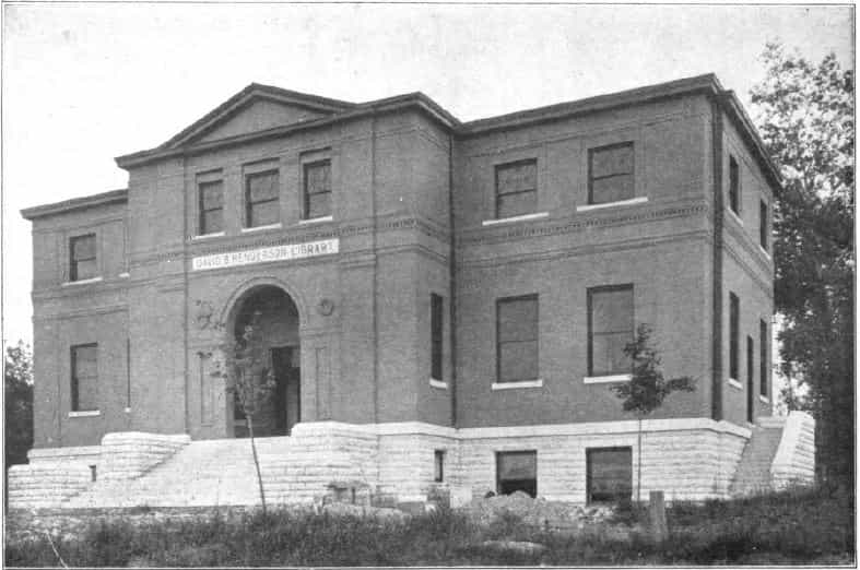 Black and white image depicting the exterior of the Upper Iowa University Library. This library was located in Fayette, Iowa, and it was the first academic library to receive a Carnegie grant (1901). It was named after David B. Henderson, a former student and personal friend of Andrew Carnegie. Taken from the 3rd Report of the Iowa Library Commission, coverage 1905-1906. (Published in 1907), opposite page 53.