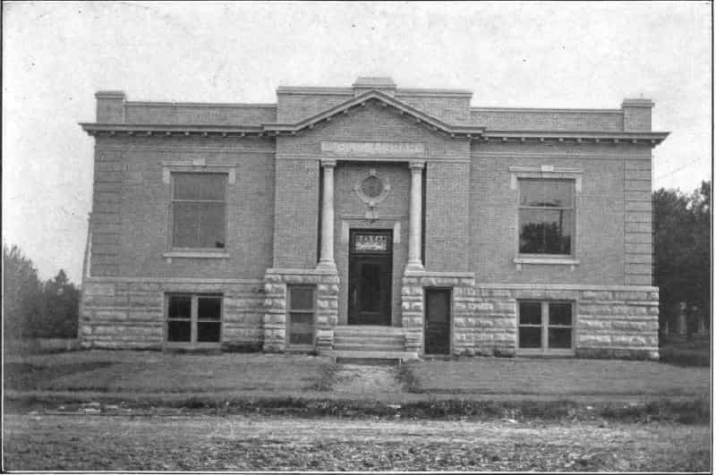 Black and white image depicting the front exterior of the Winterset Public Library. 
