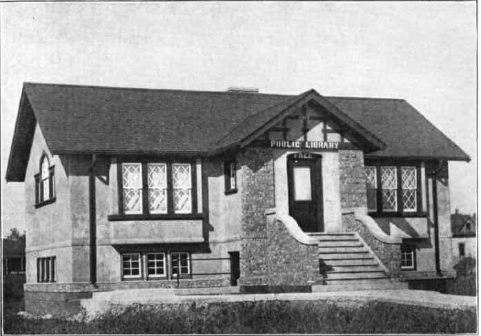 Black and white image showing the front exterior of the Laurens Public Library. 