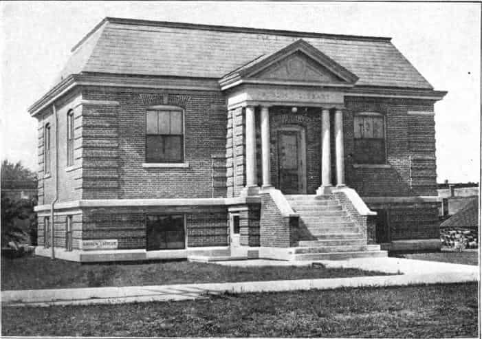 Black and white image showing the front exterior of the Stuart Public Library. 