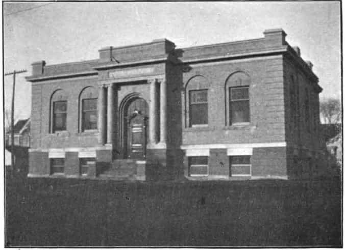 Black and white image depicting the front exterior of the Cherokee Public Library. 