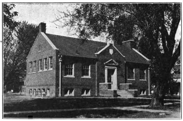 Black and white image showing the front and side exterior of the Corydon Public Library. Taken from the 10th Report of the Iowa Library Commission, coverage 1918-1920. (Published in 1920), page 7.