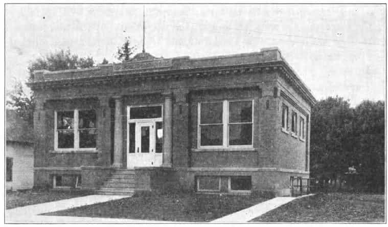 Black and white image showing the front exterior of the Garner Public Library. Taken from the 8th Report of the Iowa Library Commission, coverage 1914-1916. (Published in 1916), page 21.