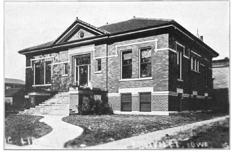 Black and white image showing the front and side exterior of the Knoxville Public Library. Text reads "[Public] Library, Knoxville Iowa" Taken from the 7th Report of the Iowa Library Commission, coverage 1912-1914. (Published in 1914), opposite page 13.