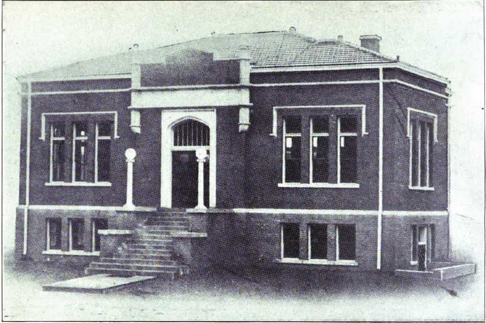 Black and white image showing the front exterior of the Spirit Lake Public Library. 
